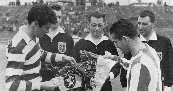 Sporting and MTK captains exchange pennants ahead of kick-off under the watchful gaze of the officials