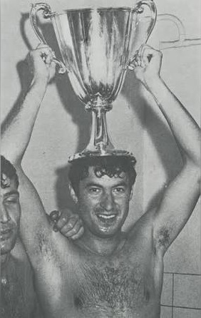 Sporting captain Fernando Mendes celebrates by perching the Cup Winners’ Cup trophy on his head